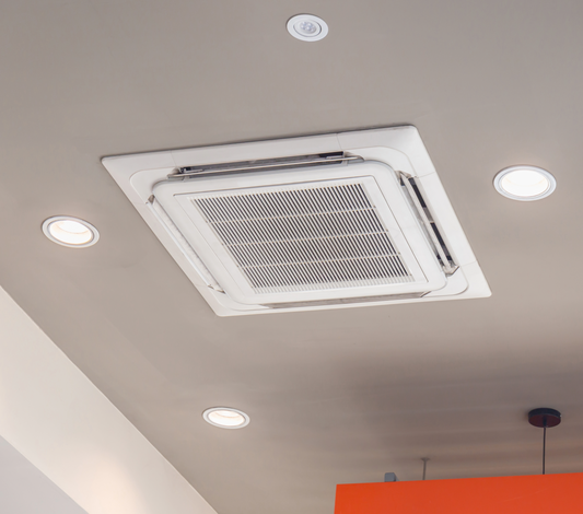 Certified engineers installing commercial air conditioning and ventilation systems in London restaurant